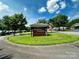Charming entrance to Needle Stone Townhomes community with mature trees and well-manicured landscaping at 2541 26Th Ne Ave, Hickory, NC 28601