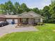 Attractive townhome with brick accents, a single-car garage, and a neatly landscaped front yard at 2541 26Th Ne Ave, Hickory, NC 28601