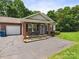 Charming brick townhome featuring a covered entry, neat landscaping, and a private, attached single-car garage at 2541 26Th Ne Ave, Hickory, NC 28601