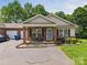 Charming single-story home with a brick facade, complemented by a well-maintained lawn and front yard landscaping at 2541 26Th Ne Ave, Hickory, NC 28601
