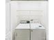 Practical laundry area equipped with a washer, dryer, and overhead storage shelving at 2541 26Th Ne Ave, Hickory, NC 28601