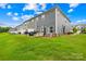 Backyard with well-maintained lawn and a patio area for outdoor seating and barbecuing at 2717 Aubrey St, Monroe, NC 28110
