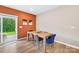 Comfortable dining area with wood floors, modern table and chairs, and natural light at 2717 Aubrey St, Monroe, NC 28110