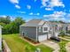 Beautiful townhome featuring a two-car garage, landscaped lawn, and ample parking at 2717 Aubrey St, Monroe, NC 28110