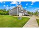 Inviting two-story townhome showcasing a well-kept lawn and a convenient two-car garage at 2717 Aubrey St, Monroe, NC 28110