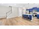 Well-lit kitchen area featuring a breakfast bar, stainless appliances, and ample countertop space at 2717 Aubrey St, Monroe, NC 28110