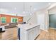 Bright open-plan living room featuring modern island, and seamless flow to the dining and Gathering spaces at 2717 Aubrey St, Monroe, NC 28110