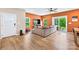 Spacious living room with wood floors, a large sectional sofa, and an adjacent patio at 2717 Aubrey St, Monroe, NC 28110