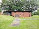 Brick house with a back deck, a full basement, and an expansive lawn at 3115 Falling Creek Rd, Hickory, NC 28601