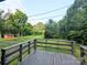 Enjoy the beautiful, verdant backyard from the deck, creating a serene, wooded oasis at 3115 Falling Creek Rd, Hickory, NC 28601