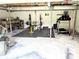 Unfinished basement transformed into home gym with squat rack, free weights, treadmill and plenty of space at 3115 Falling Creek Rd, Hickory, NC 28601