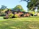 Beautiful brick home with a spacious front yard and mature trees offering shade and curb appeal at 3115 Falling Creek Rd, Hickory, NC 28601