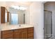 Bathroom with a vanity and large mirror at 328 Burrage Ne Rd, Concord, NC 28025