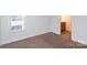 Bedroom featuring carpet floors and a window at 328 Burrage Ne Rd, Concord, NC 28025