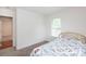 Bedroom featuring neutral carpet, a window, and white trim at 328 Burrage Ne Rd, Concord, NC 28025
