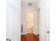 Hallway featuring hardwood floors and access to the bathroom at 328 Burrage Ne Rd, Concord, NC 28025