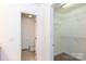 Hallway featuring a toilet and a walk-in closet at 328 Burrage Ne Rd, Concord, NC 28025