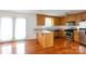 The kitchen is equipped with wood cabinets, stainless steel appliances, and a breakfast bar at 328 Burrage Ne Rd, Concord, NC 28025