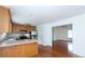 Bright kitchen featuring hardwood floors, white walls, and stainless appliances at 328 Burrage Ne Rd, Concord, NC 28025