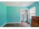 Bright bedroom with wood-look floors, a closet, and natural light from the window at 336 Oakwood Dr, Mount Holly, NC 28120
