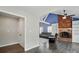 Open living room with a brick fireplace, built-in shelving, and plush seating at 336 Oakwood Dr, Mount Holly, NC 28120