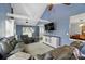 Open-concept living room featuring vaulted ceilings, comfortable seating, and ample natural light at 336 Oakwood Dr, Mount Holly, NC 28120