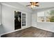 Sun room with sliding glass door to living room and many windows at 336 Oakwood Dr, Mount Holly, NC 28120