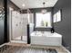 Elegant bathroom with a standalone tub and a separate glass-enclosed shower at 417 Livingston Dr, Lancaster, SC 29720