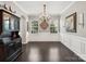 Formal dining room with wood floors, chandelier, and elegant wainscoting at 417 Livingston Dr, Lancaster, SC 29720