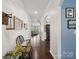 Bright foyer with wood floors and decorative bench, leading to other rooms at 417 Livingston Dr, Lancaster, SC 29720