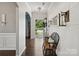 Bright foyer with wood floors and decorative bench, leading to the front door at 417 Livingston Dr, Lancaster, SC 29720