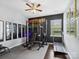 Home gym with weights, pull-up rack, and a treadmill on rubber flooring at 417 Livingston Dr, Lancaster, SC 29720