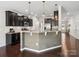 Well-equipped kitchen with dark cabinetry, stainless steel appliances, and a stylish wood-paneled island at 417 Livingston Dr, Lancaster, SC 29720