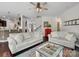 Spacious living room with dark wood floors and neutral furniture, adjacent to the kitchen and stairway at 417 Livingston Dr, Lancaster, SC 29720