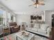 Open-concept living room with dark wood floors, comfortable seating, and views into the kitchen and dining area at 417 Livingston Dr, Lancaster, SC 29720