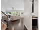 Bright living room with dark wood floors, fireplace, and multiple windows providing ample natural light at 417 Livingston Dr, Lancaster, SC 29720
