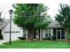 Charming single-story home featuring a well-manicured lawn, attached garage, and inviting screened porch at 4492 Antelope Ln, Charlotte, NC 28269