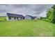 Spacious backyard with lush green lawn and views of neighboring homes, great for entertaining at 4511 Hunton Dale Nw Rd, Concord, NC 28027