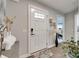 Welcoming foyer with a stylish front door, elegant decor, and hardwood floors at 4511 Hunton Dale Nw Rd, Concord, NC 28027