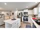 Modern kitchen with white cabinets and stainless steel appliances at 4511 Hunton Dale Nw Rd, Concord, NC 28027