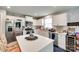 Bright kitchen with white cabinets, stainless steel appliances, and center island at 4511 Hunton Dale Nw Rd, Concord, NC 28027