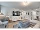 Bright living room featuring stylish decor and hardwood flooring at 4511 Hunton Dale Nw Rd, Concord, NC 28027