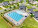 Aerial view of a pristine community pool area with plenty of seating and manicured landscaping at 4511 Hunton Dale Nw Rd, Concord, NC 28027