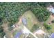 An aerial view of a home with surrounding trees and a lush green yard at 4630 Irish Potato Rd, Kannapolis, NC 28083