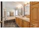 Bathroom featuring a double vanity, mirrors, and a soaking tub at 4630 Irish Potato Rd, Kannapolis, NC 28083