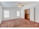 Bright bedroom includes an open closet and ample natural light from multiple windows at 4630 Irish Potato Rd, Kannapolis, NC 28083