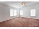 Spacious bedroom featuring neutral walls, carpet flooring, and a ceiling fan at 4630 Irish Potato Rd, Kannapolis, NC 28083