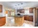Bright kitchen with dark countertops, stainless steel appliances, and center island for added prep space at 4630 Irish Potato Rd, Kannapolis, NC 28083