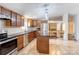 Open kitchen with dark countertops, stainless steel appliances, and center island, great for entertaining at 4630 Irish Potato Rd, Kannapolis, NC 28083