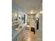 Compact bathroom featuring sink, toilet, and accessible shower at 5022 Wrenn Dr, Denver, NC 28037